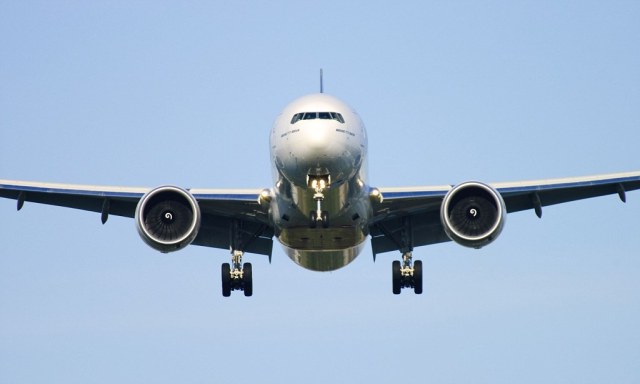 Boeing 777 plane seen head on making its final approach for landing at London Heathrow Airport